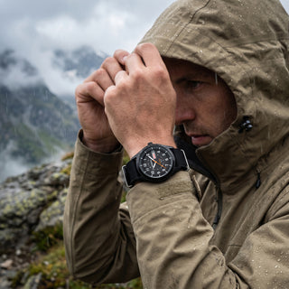 wearing infantry military field watch black in the raining day REVO-FW01-BK-BKN-03